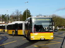 Postauto - MAN  ZH 780685 bei den Bushaltestellen beim Bahnhof in B�lach am 01.04.2011