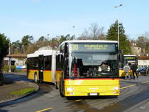 Postauto - MAN ZH 780686 bei den Bushaltestellen beim Bahnhof in B�lach am 01.04.2011

