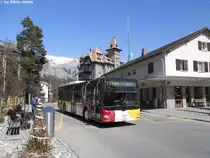 Ortsbus Flims (Postauto)/PU Stuppan GR 64143 (MAN Lion's City A21) am 3.4.2011 in Flims Waldhaus, Post. Die Standard-Wagen kommen auf dem Flimser-Ortsbusnetz in der Regel nur w�hrend der Wintersaison im Einsatz, jedoch daurt diese bis Mitte April, so dass man die ''Winterwagen'' auch bei fr�hlingshaften 20�C fotografieren kann.