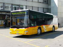 Postauto - MAN  JU 35166 bei den Bushaltestellen bei der Post in Delemont am 16.04.2011