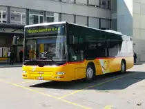 Postauto - MAN  JU 35166 bei den Bushaltestellen bei der Post in Delemont am 16.04.2011