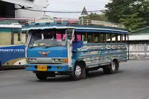 Lokalbus (Song Teow) Nr 1812-5, eingesetzt auf der Strecke Patong-Phuket Town am 10.J�nner 2012 im Busterminal von Phuket Town.