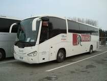 Scania Irizar de l'entreprise Realitours (Italie) avec graphique Maximo photographi le 02.02.2012 sur l'aire du restauroute de Payerne (Suisse)