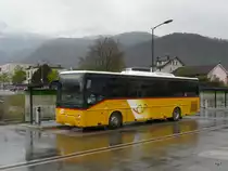 Postauto - Renault Ares  VS 236173 auf dem Bahnhofsplat in Aigle am 08.04.2012