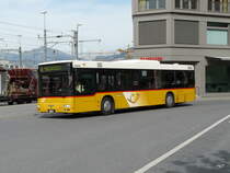 Postauto - MAN  GR 9705 unterwegs vor dem Bahnhof in Chur am 18.09.2012