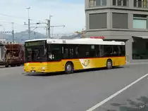 Postauto - MAN  GR 9705 unterwegs vor dem Bahnhof in Chur am 18.09.2012