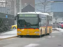 Postauto - Mercedes Citaro BE  611734 am warten in Zollikofen am 20.12.2012