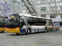 Postauto - MAN Lion`s Regio  GR  162988 mit Werbung bei den Postautohaltestellen in Chur am 20.01.2013