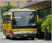 Setra S 415 UL Grindelwaldbus stand am 01.08.2008 in Meiringen am Bahnhof.