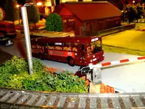 Dieser Mercedes-Benz O 307 als Bahnbus mit klassischer J�germeister-Reklame von Brekina steht an einem Bahn�bergang und wartet auf Weiterfahrt. Die Aufnahme entstand auf meiner privaten Modelleisenbahnanlage.